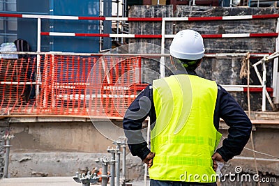 Construction Supervisor Wearing green safety shirt Standing back Looking at the front Check the work done In the area that is Editorial Stock Photo