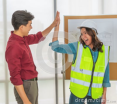 Construction Team congratulating teamate for successfull project meeting Stock Photo