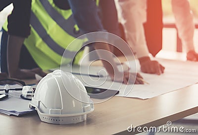 Construction team engineer architect is brainstorming on working table with building plan Stock Photo