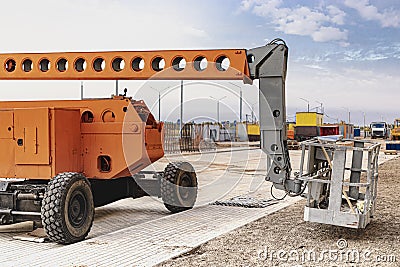 Construction telescopic tower or work platform for people to work at height. Powerful work platform for lifting construction Editorial Stock Photo