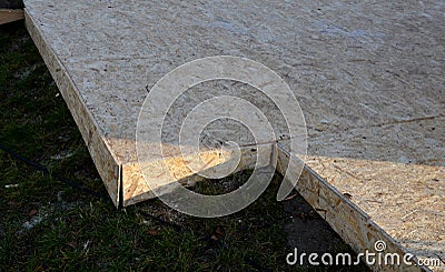 Construction of a temporary terrace from osb boards for the location of park benches that are in campsites and on forest rest area Stock Photo