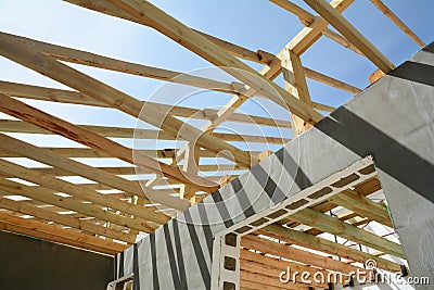 The construction of the thermo house. The construction of the thermo house. Wooden frame building. Wooden roof construction. Stock Photo
