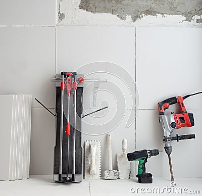 Construction tools as tiles cutter electric hammer drill Stock Photo