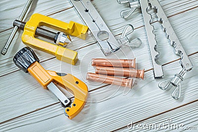Construction tools set for flaring pipe brake plumper clamp cutter on wooden background Stock Photo