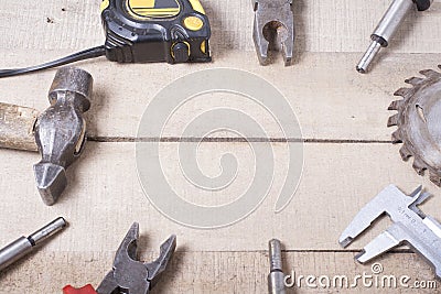 Construction tools on wooden background. Copy space for text. Set of assorted work tool at wood table . Top view Stock Photo
