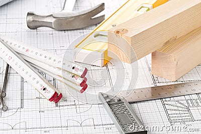 Construction tools and wooden strips on architectural blueprint house building plan Stock Photo