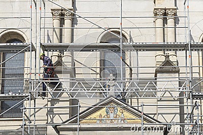 Construction worker on the scaffolding Editorial Stock Photo