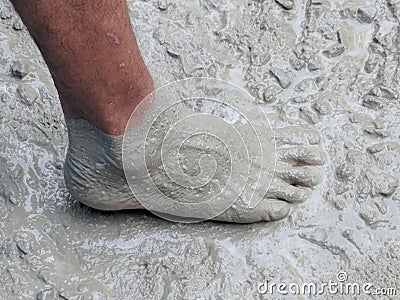 Construction worker barefoot in liquid concrete Stock Photo