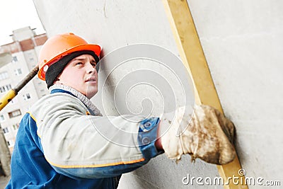 Construction worker. Builder concreter with level Stock Photo