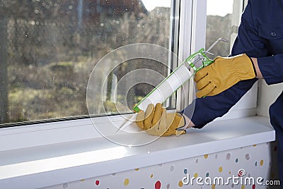 Silicone sealant and windows Stock Photo