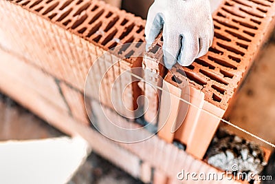 Construction worker completing interior walls, building details Stock Photo