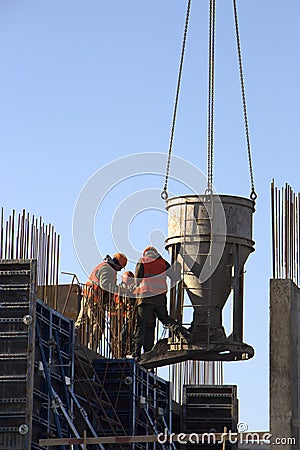 Concrete pouring during commercial concreting floors of building in construction site and Civil Engineer Editorial Stock Photo