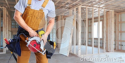 Construction worker with electric saw Stock Photo