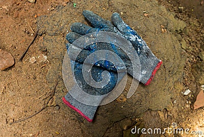 Construction worker, Gardner, painter, gloves worn out due to heavy work Stock Photo