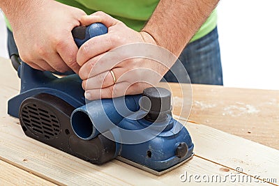 Construction worker hands and power tool Stock Photo