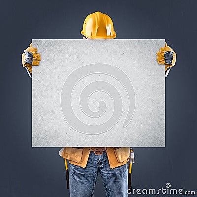 Construction worker with information posters Stock Photo