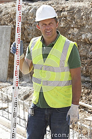 Construction Worker Laying Foundations Stock Photo