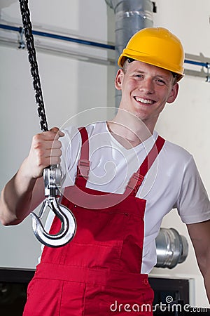 Construction worker and lifting equipment Stock Photo