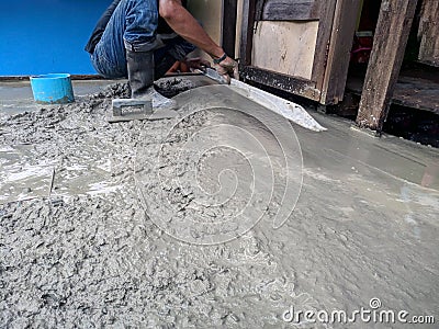 Construction worker in liquid concrete Stock Photo