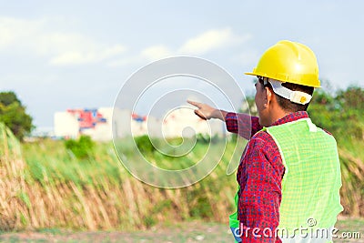 Construction Worker Planning Contractor Checking at site gas, oil, energy and factory construction. Engineer hand point Stock Photo