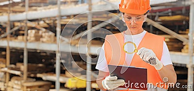 Construction worker produces top reports in a building materials Stock Photo