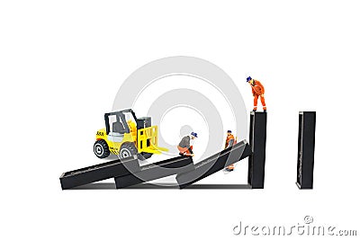Construction worker repairman working check and repair dominoes piece damaged. Stock Photo