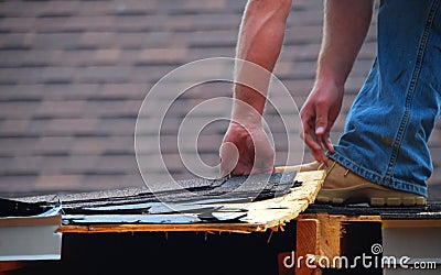 Construction worker on roof Stock Photo