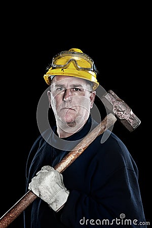Construction worker with sledgehammer Stock Photo