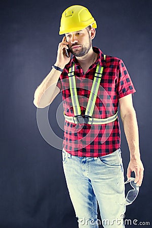 Construction Worker talking on a cell phone Stock Photo