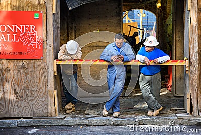 Construction workers on break Editorial Stock Photo