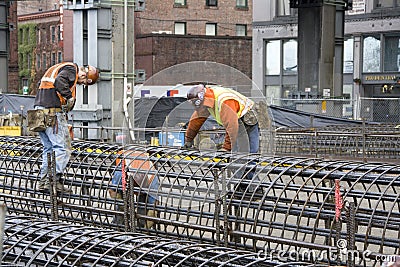 Construction workers building Editorial Stock Photo