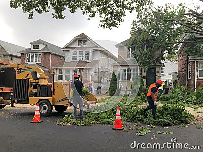 Construction Workers Cleaning up Tree Damage in Queens New York from Tropical Storm Isaias NY Editorial Stock Photo