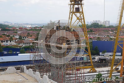 Construction workers fabricating steel reinforcement bar at the construction site. Editorial Stock Photo