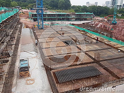 Construction workers fabricating steel reinforcement bar at the construction site. Editorial Stock Photo