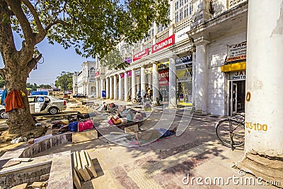 Construction workers relax at connaught place Editorial Stock Photo