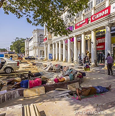 Construction workers relax at Connaught place Editorial Stock Photo