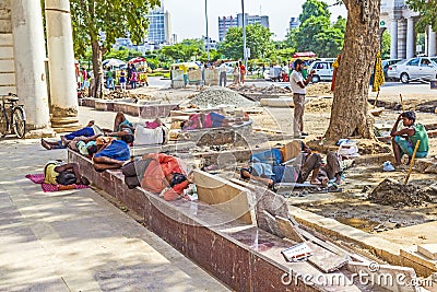 Construction workers relax at Editorial Stock Photo
