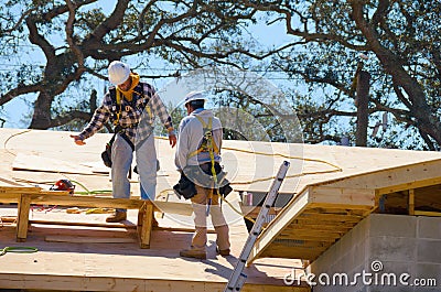 Construction workers wearing safety harness lifeline Editorial Stock Photo