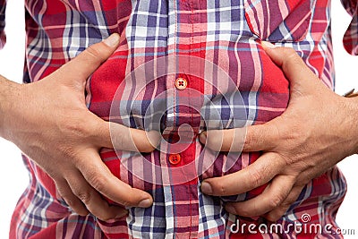 Constructor grabbing bloated stomach Stock Photo