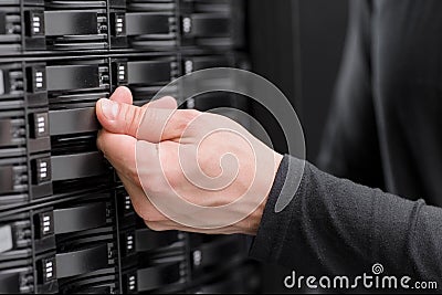 IT consultant maintain large SAN array in datacenter Stock Photo