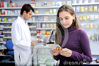 Consumer with medicine at pharmacy Stock Photo