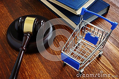 Consumer protection law concept. Shopping cart and gavel Stock Photo