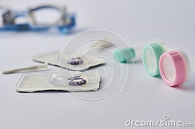 Contact lens with optometrist equipment tools on white background Stock Photo