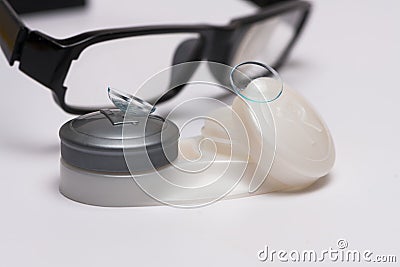 Contact lenses on case and optical glasses Stock Photo