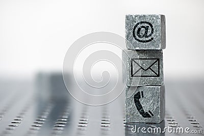 Contact options for support printed on cube Stock Photo