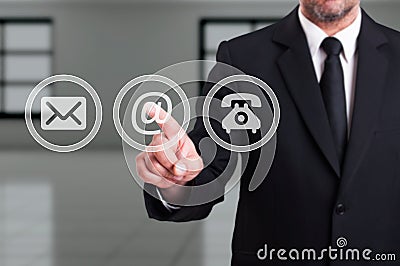 Contact our company concept with businessman pressing email Stock Photo