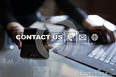 Contact us button and text on virtual screen. Business and technology concept. Stock Photo