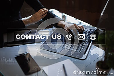 Contact us button and text on virtual screen. Business and technology concept Stock Photo