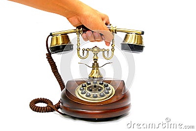 Contact Us Now, customer client hand picking pick up Brass Receiver of Vintage Antique Wooden Phone to call business vendor Stock Photo
