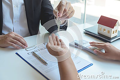 Contacting the buying or selling of real estate through a sales representative offering a contract to buy a house or apartment, Stock Photo